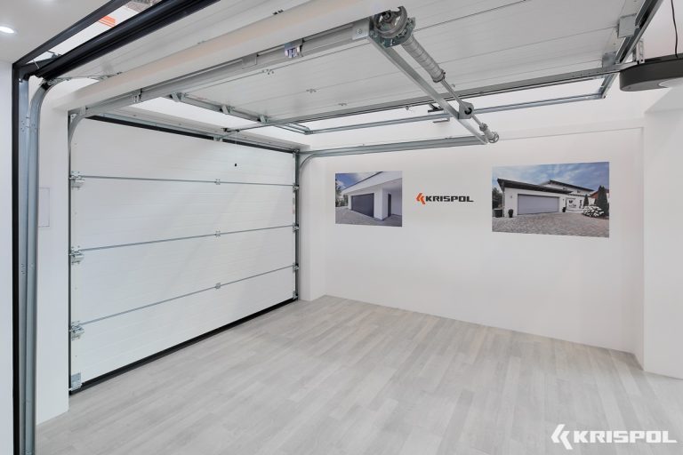 A white door and wall in a garage.